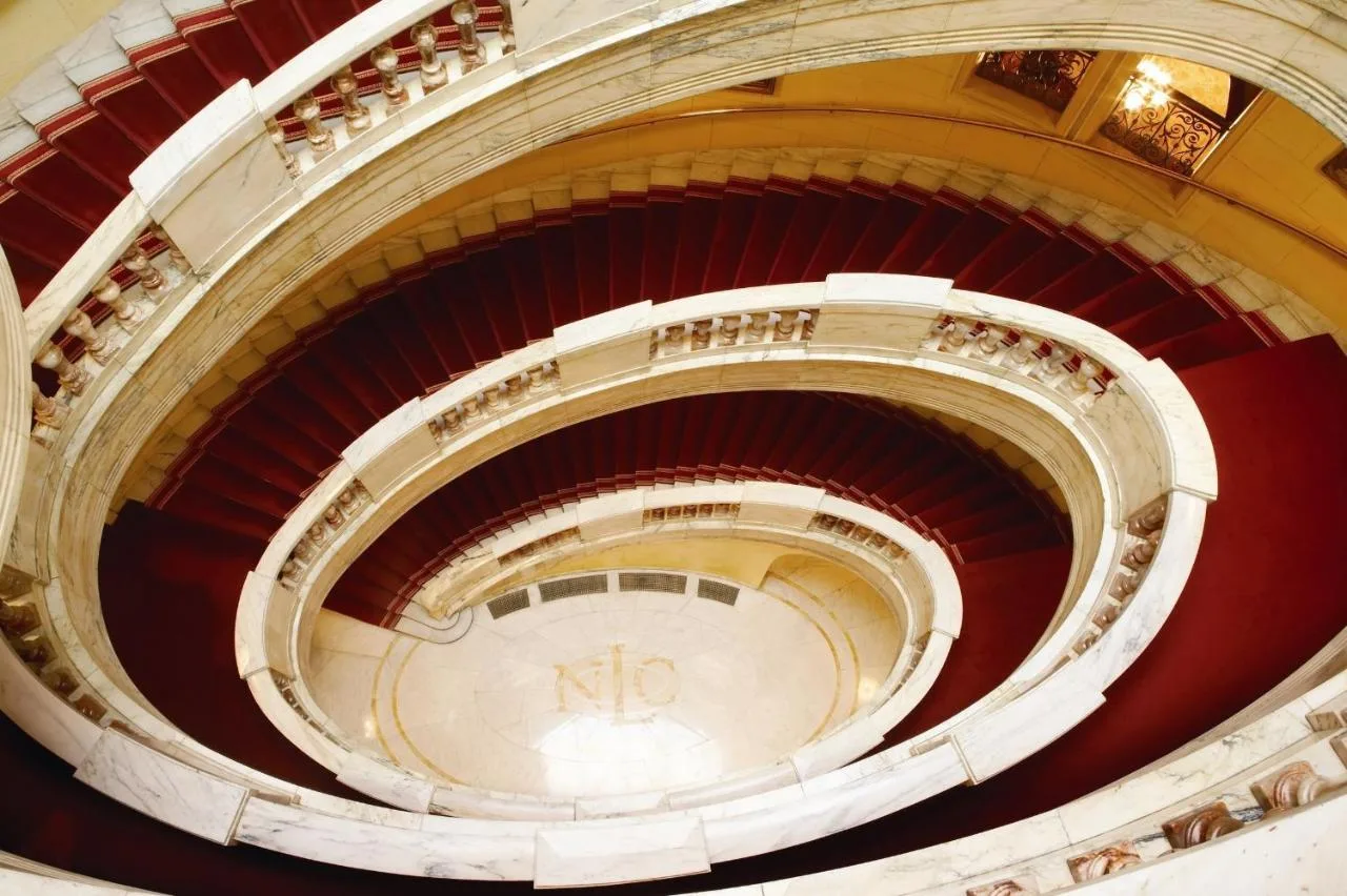 an overhead view of a spiral staircase in a building at The Royal Horseguards Hotel, London in London