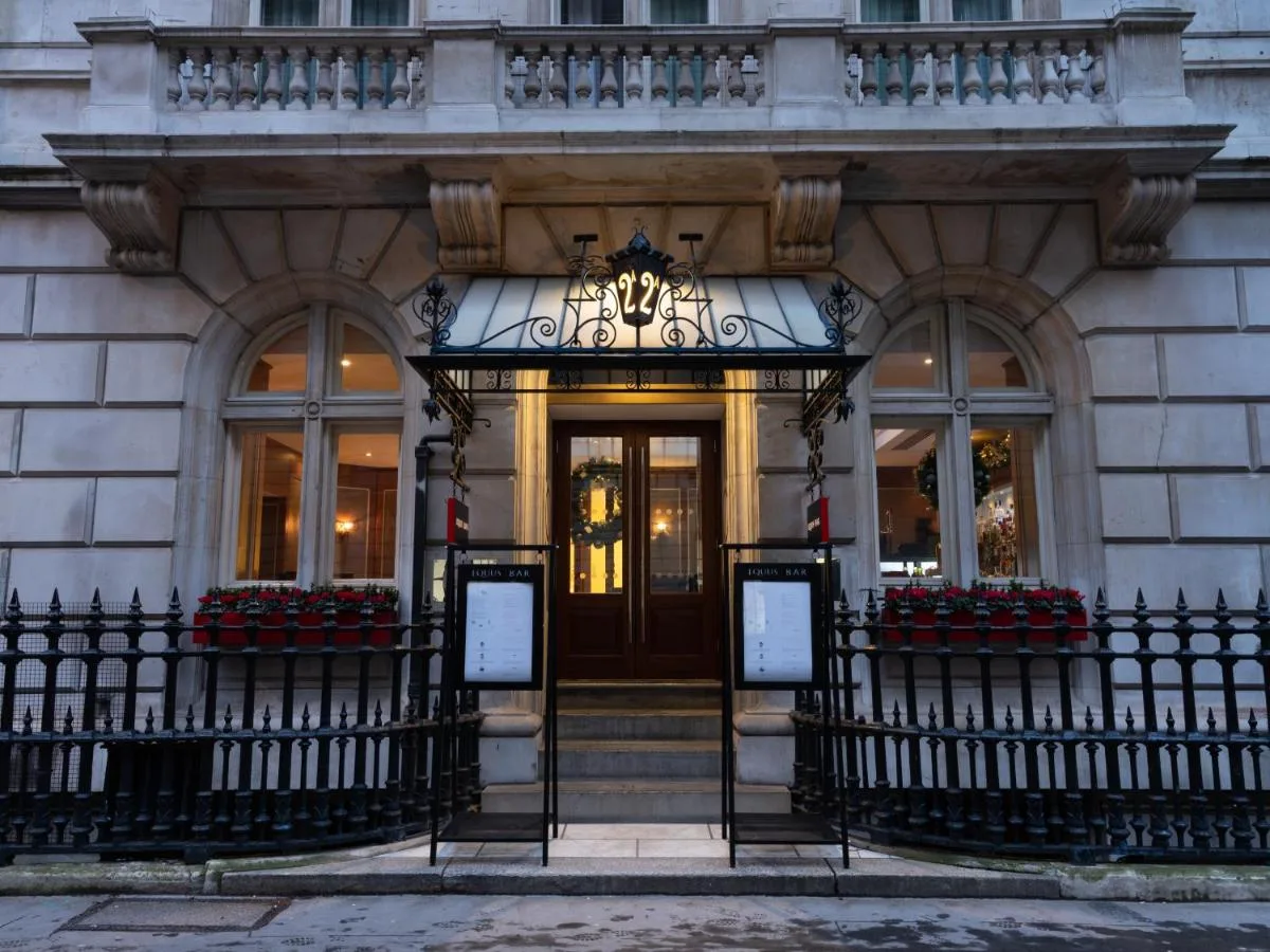 a front door of a building with a chandelier at The Royal Horseguards Hotel, London in London